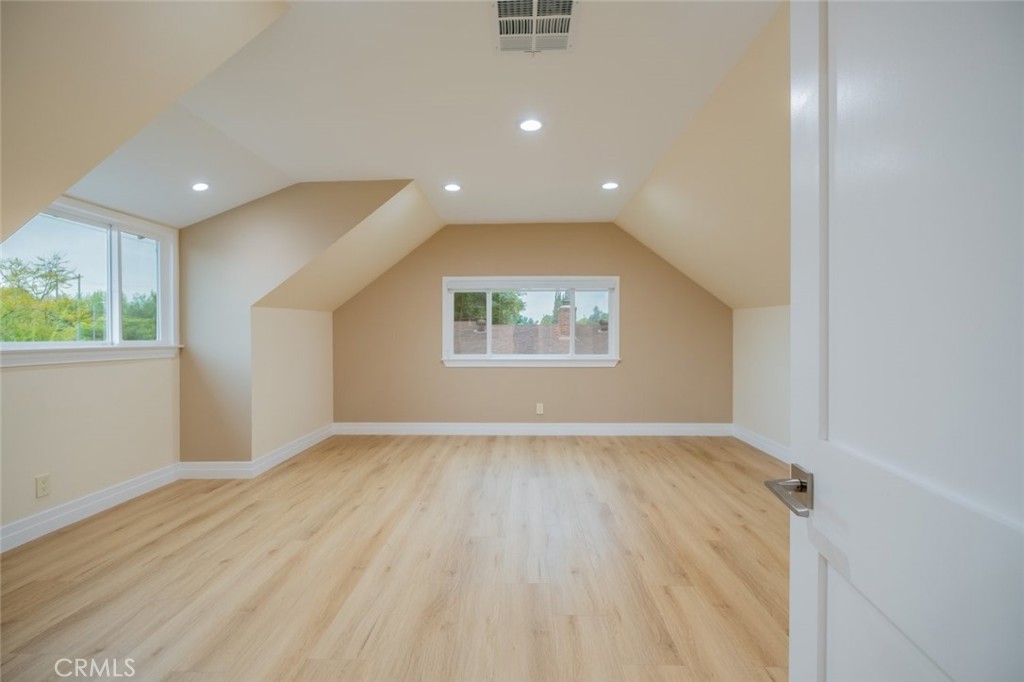 15363 Victory Boulevard Van Nuys, CA 91406 - Photo 36 of 52 an empty room with wooden floor and windows
