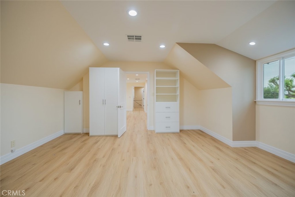 15363 Victory Boulevard Van Nuys, CA 91406 - Photo 38 of 52 an empty room with wooden floor and windows