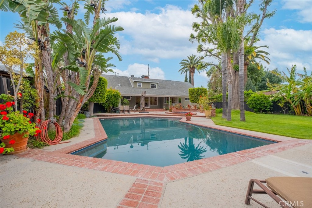 15363 Victory Boulevard Van Nuys, CA 91406 - Photo 42 of 52 a view of a swimming pool with a patio