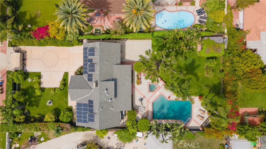 15363 Victory Boulevard Van Nuys, CA 91406 - Photo 52 of 52 an aerial view of a house with a yard and large trees