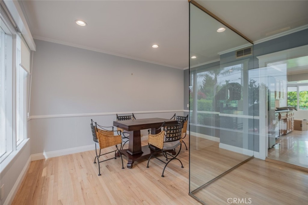 15363 Victory Boulevard Van Nuys, CA 91406 - Photo 8 of 52 a room with furniture and wooden floor