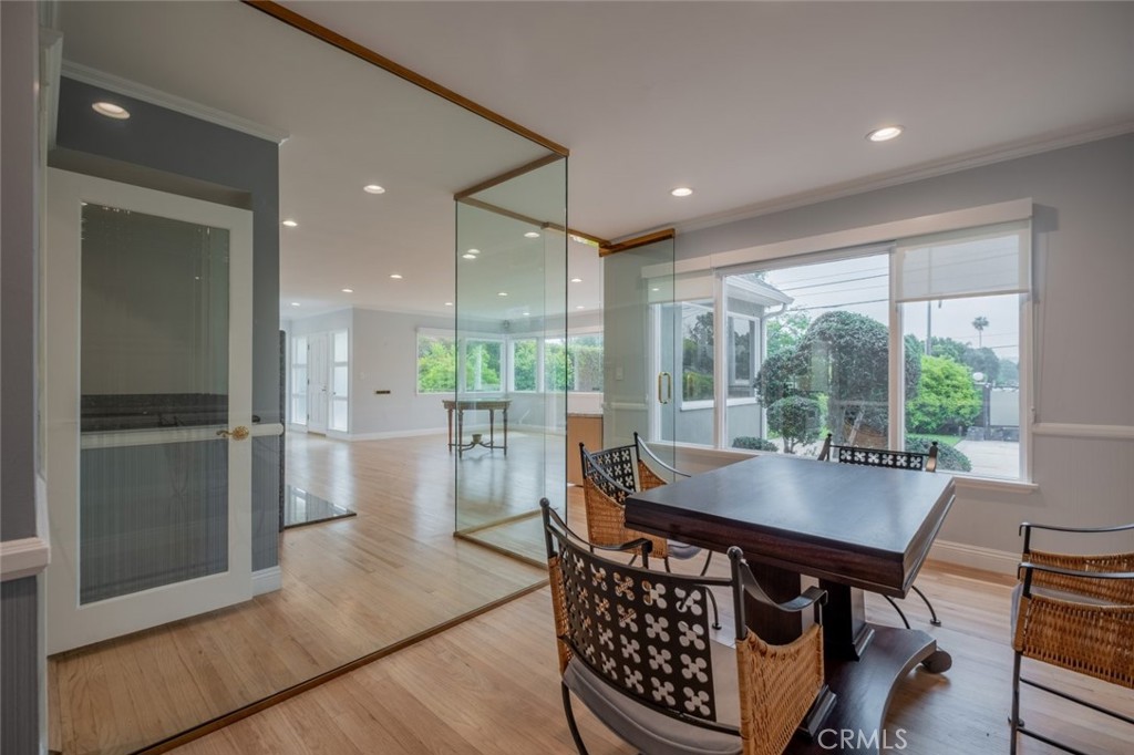 15363 Victory Boulevard Van Nuys, CA 91406 - Photo 9 of 52 a dining room with furniture and a floor to ceiling window