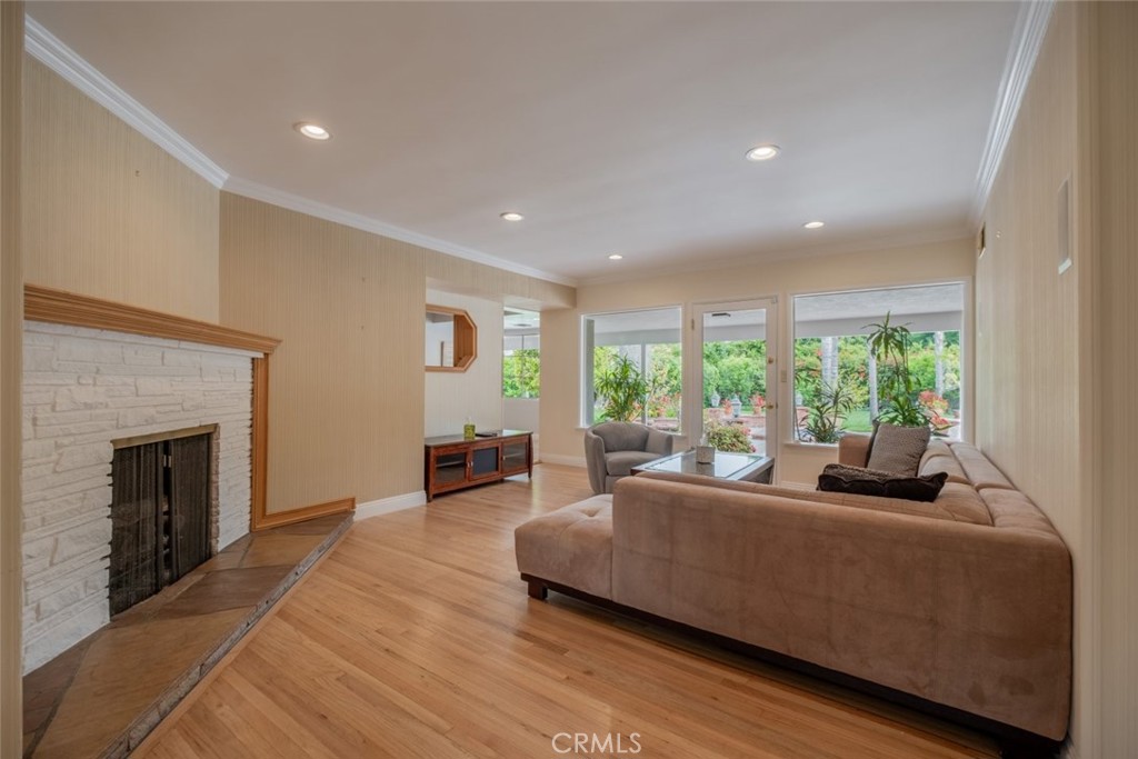15363 Victory Boulevard Van Nuys, CA 91406 - Photo 10 of 52 a living room with furniture and a fireplace