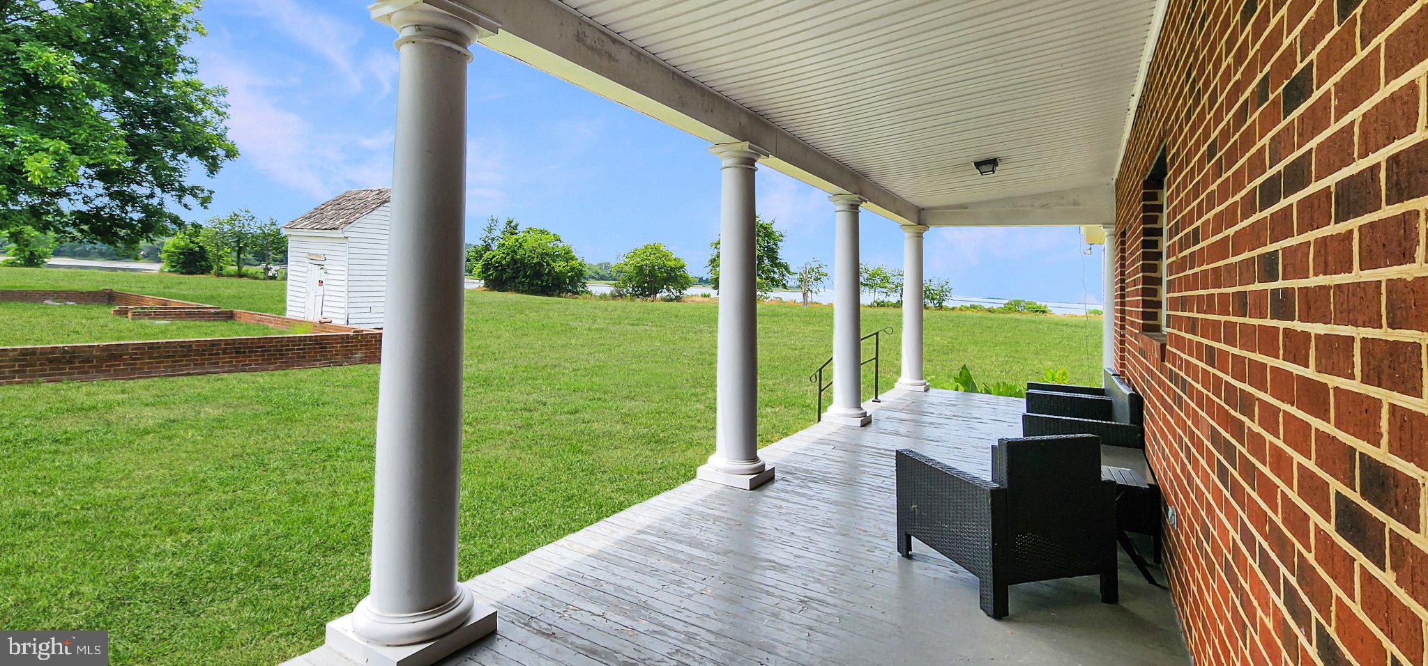 2598 Cherrystone Road Cape Charles, VA 23310 - Photo 8 of 47 Charming porch with scenic views.