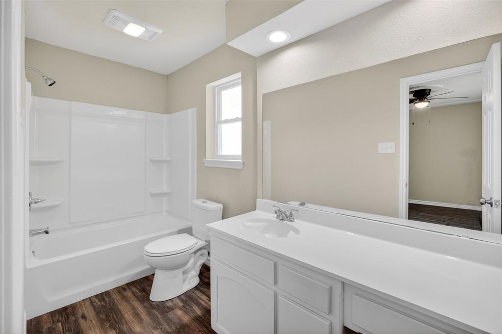 7528 Meadowlark Lane North Watauga, TX 76148 - Photo 23 of 31 a bathroom with a sink toilet and shower