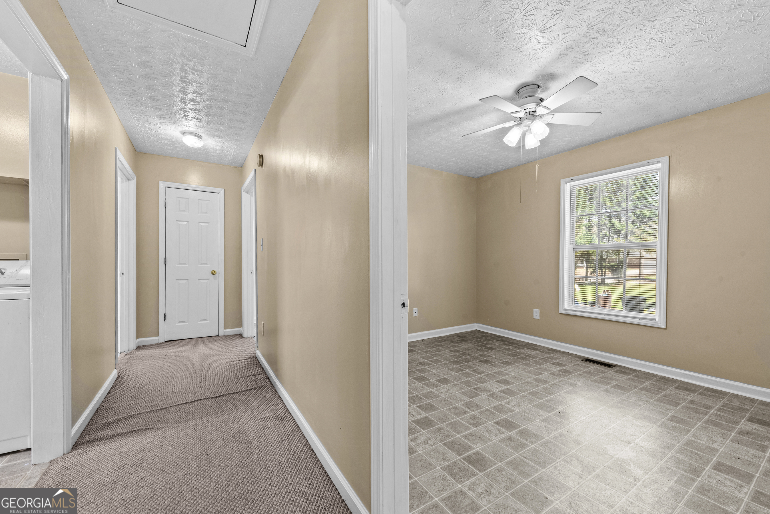 517 Gilmore Street Madison, GA 30650 - Photo 15 of 34 a view of an empty room with a window