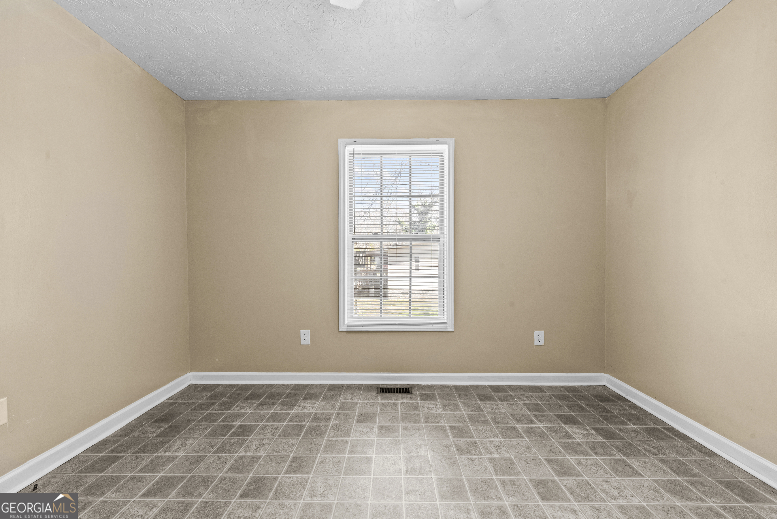 517 Gilmore Street Madison, GA 30650 - Photo 16 of 34 a view of an empty room and window
