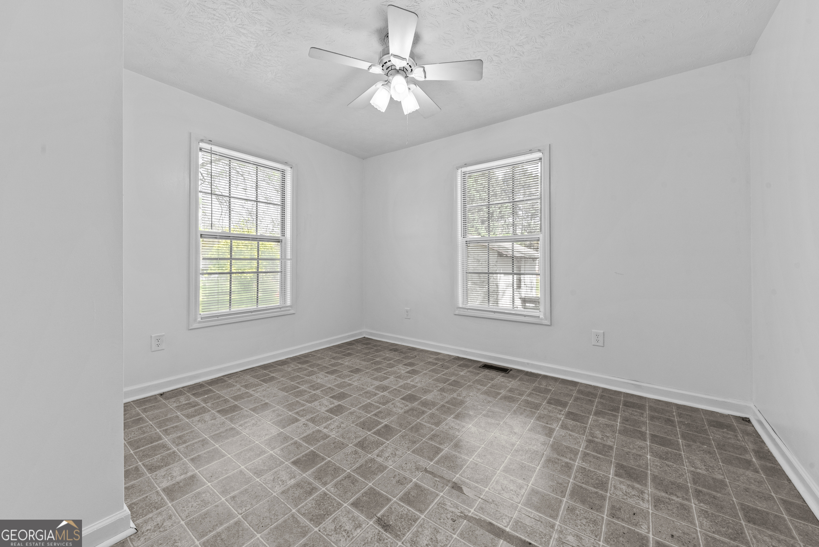 517 Gilmore Street Madison, GA 30650 - Photo 18 of 34 a view of an empty room with a window