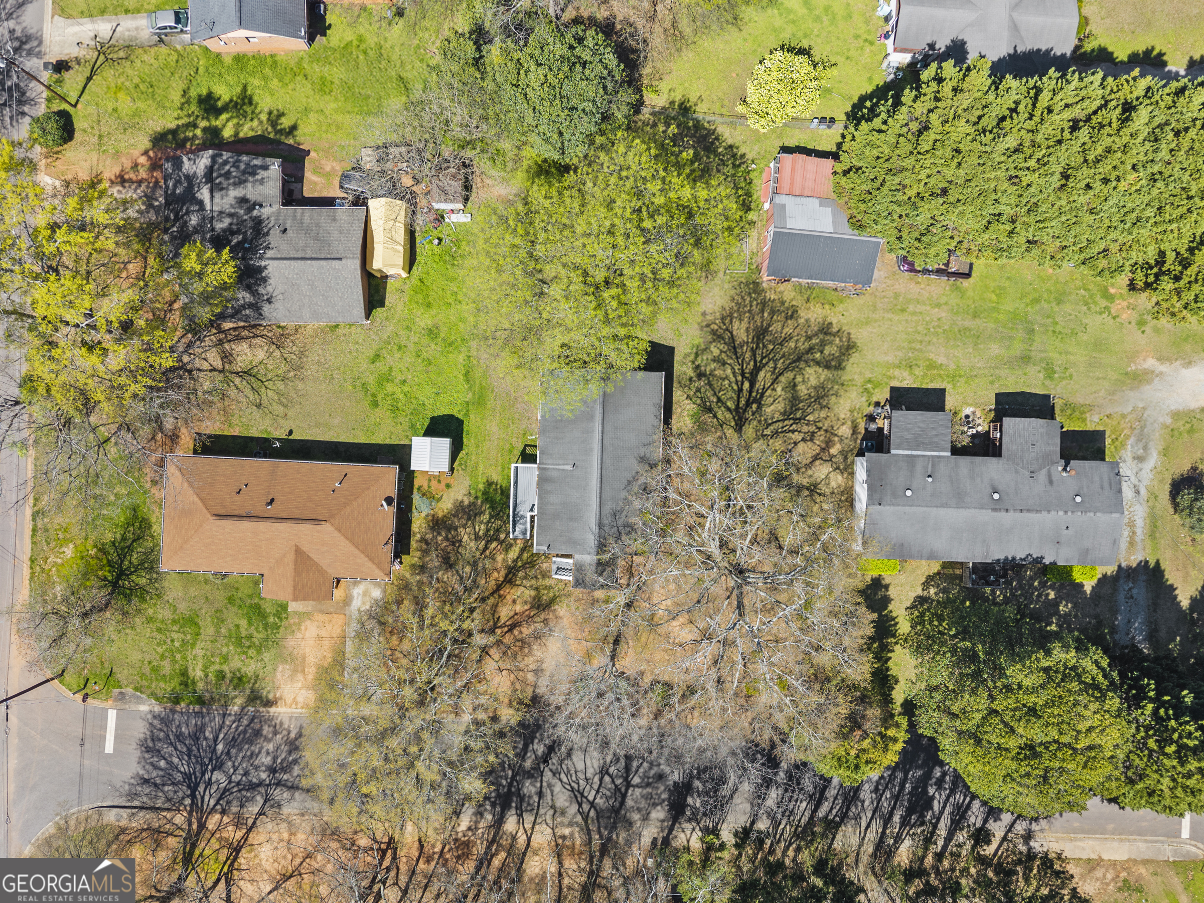 517 Gilmore Street Madison, GA 30650 - Photo 2 of 34 an aerial view of residential houses with outdoor space