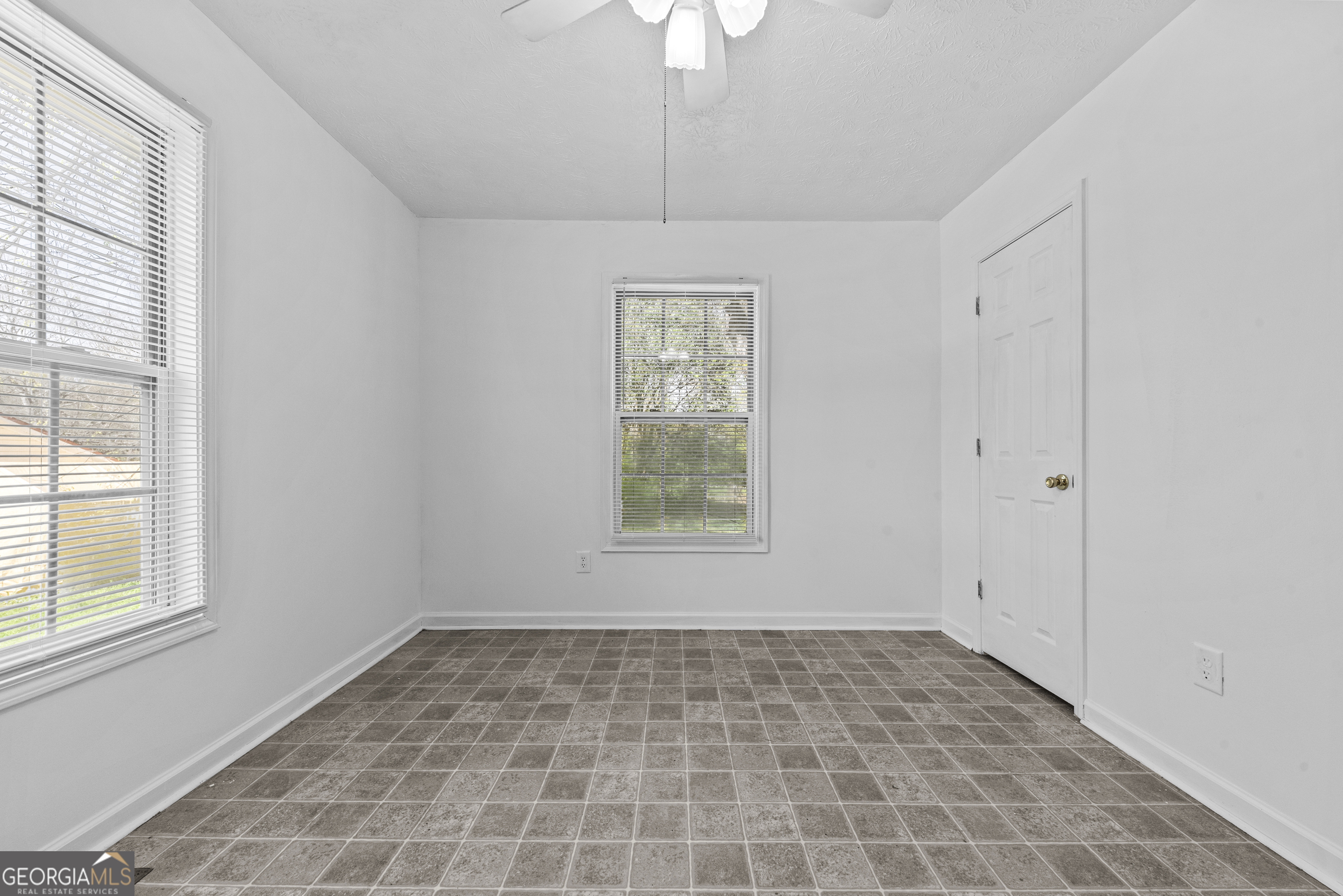 517 Gilmore Street Madison, GA 30650 - Photo 21 of 34 a view of an empty room with a window