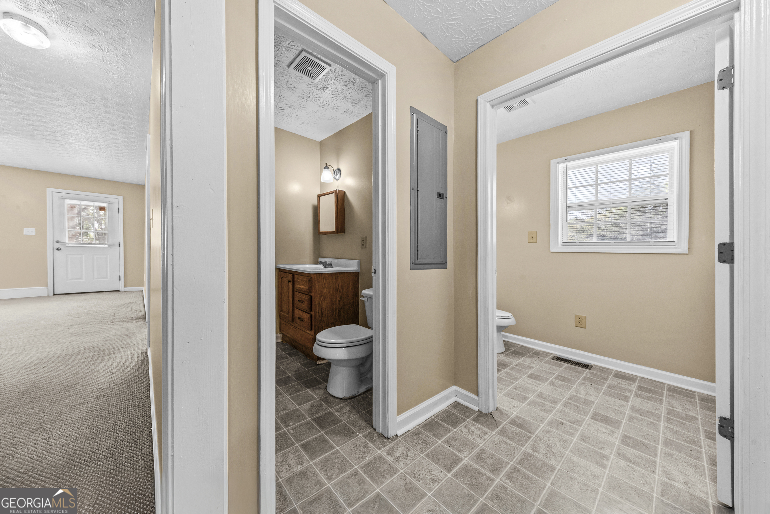 517 Gilmore Street Madison, GA 30650 - Photo 23 of 34 a bathroom with a toilet and a sink