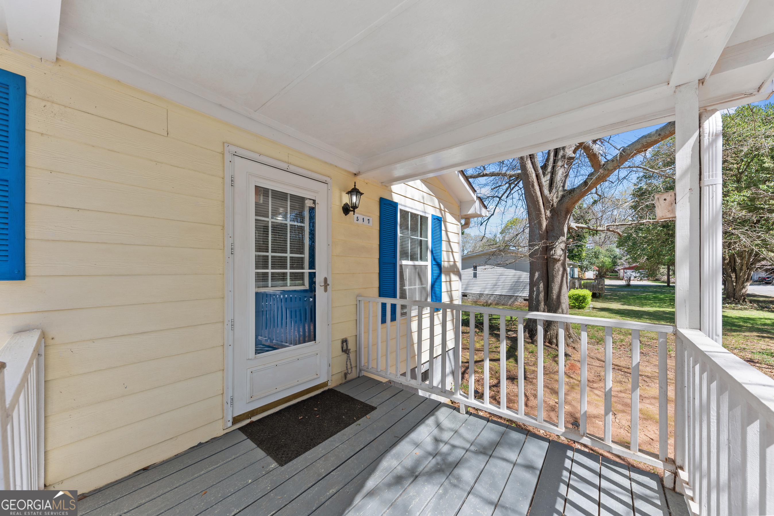 517 Gilmore Street Madison, GA 30650 - Photo 28 of 34 a view of a porch with wooden floor and outdoor space