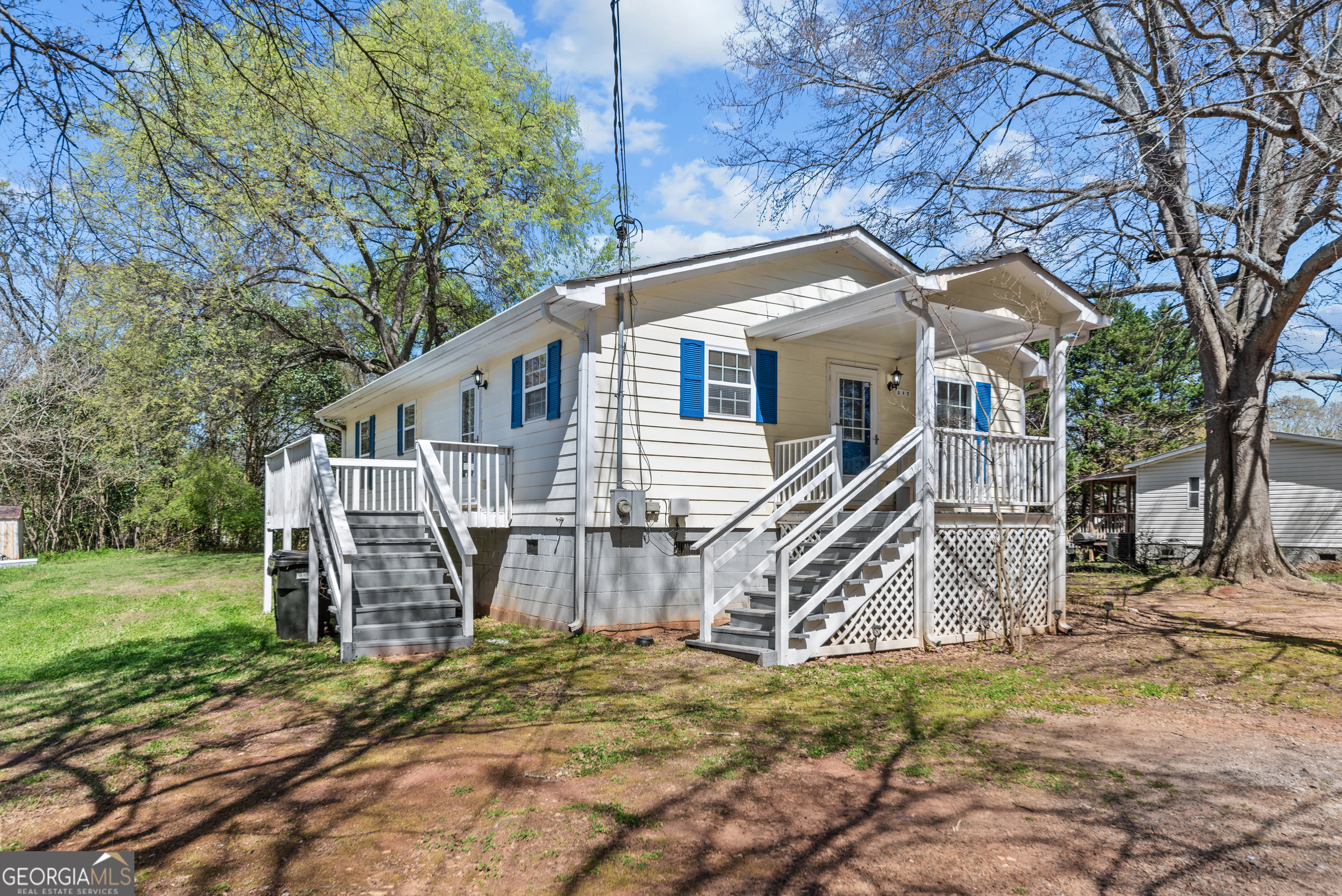 517 Gilmore Street Madison, GA 30650 - Photo 29 of 34 a view of a house with a yard
