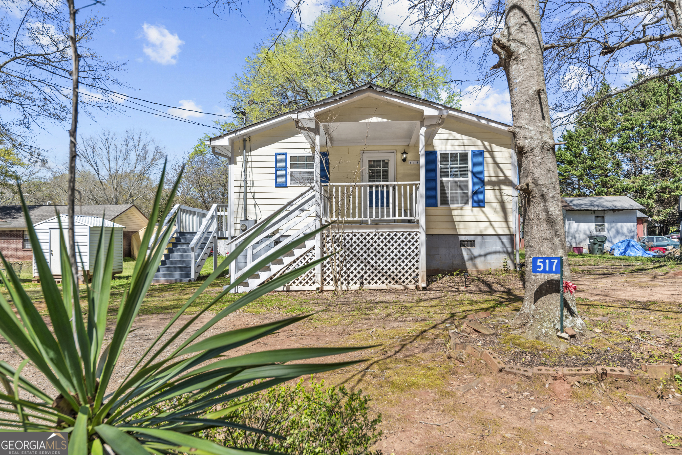 517 Gilmore Street Madison, GA 30650 - Photo 30 of 34 a front view of a house with a yard
