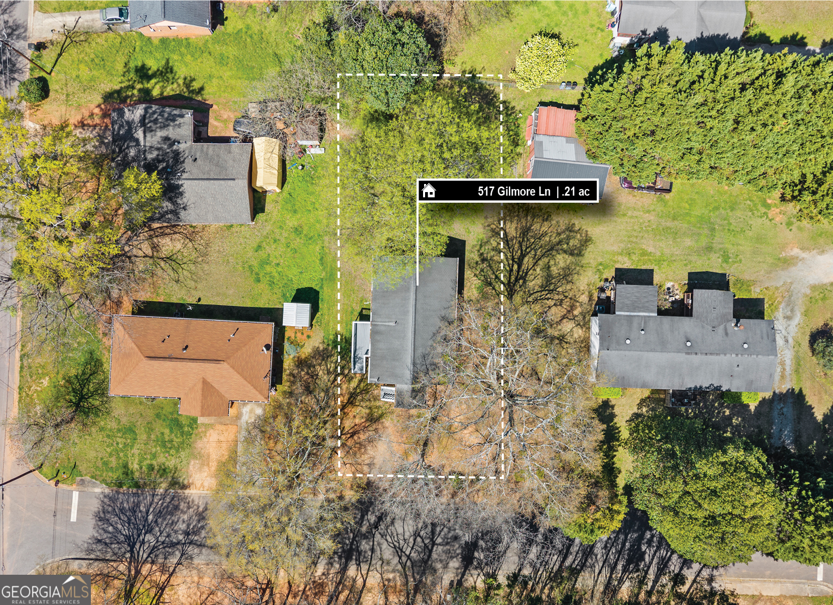 517 Gilmore Street Madison, GA 30650 - Photo 34 of 34 an aerial view of a house with a yard and garden