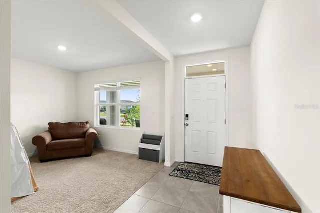 a living room with furniture and a window
