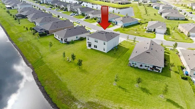 an aerial view of a house with a garden