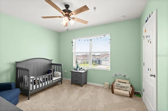 a bedroom with a bed and a chair