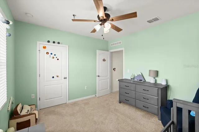 a bathroom with a toilet and bathtub