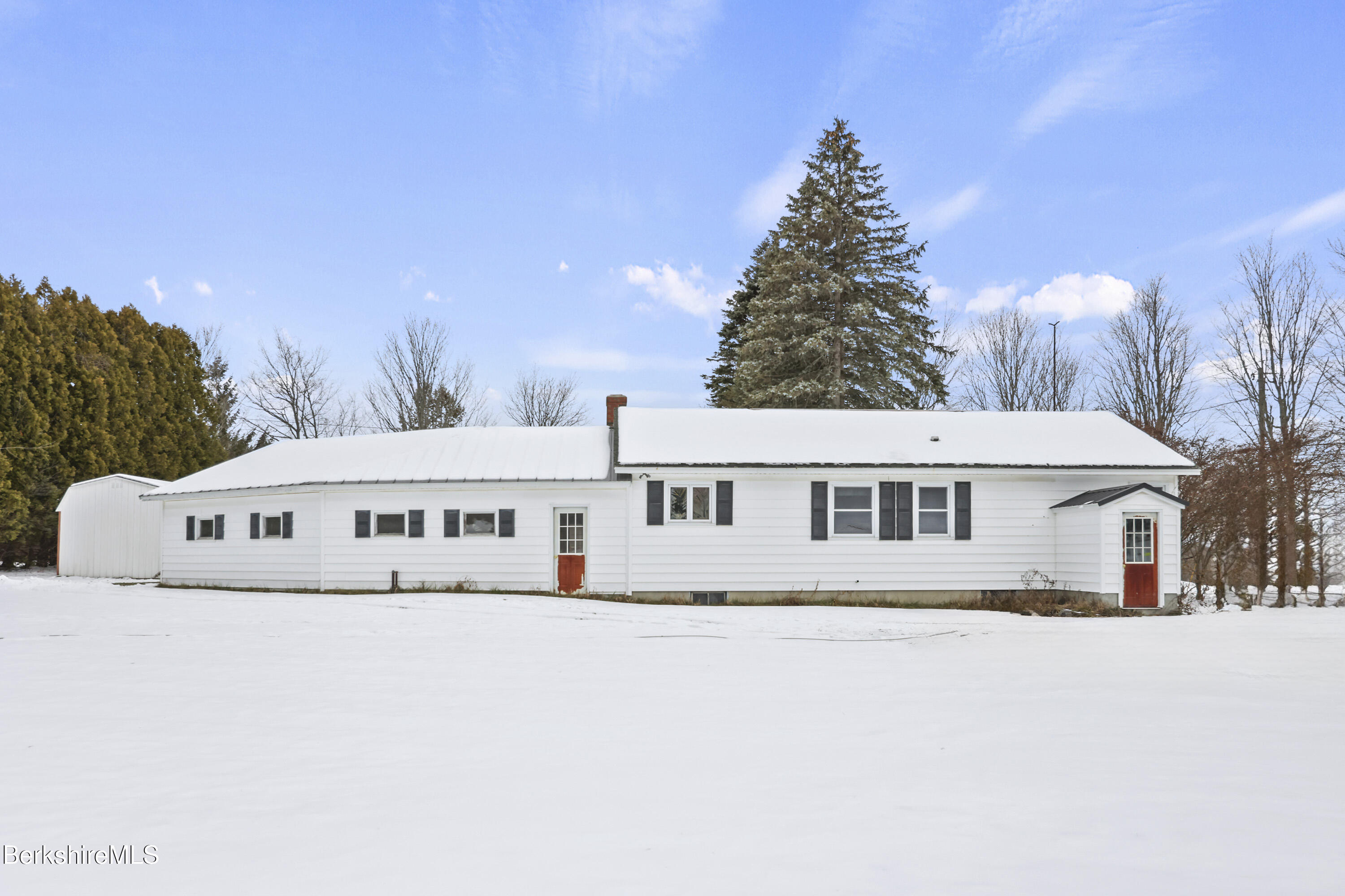 1416 Windsor Road Cheshire, MA 01225 - Photo 5 of 33 a black white and white house with a yard