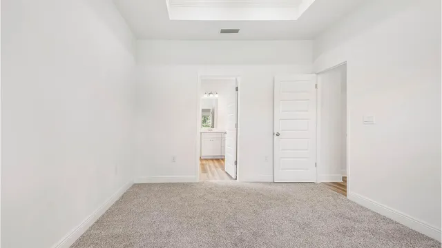 an empty room with closet area