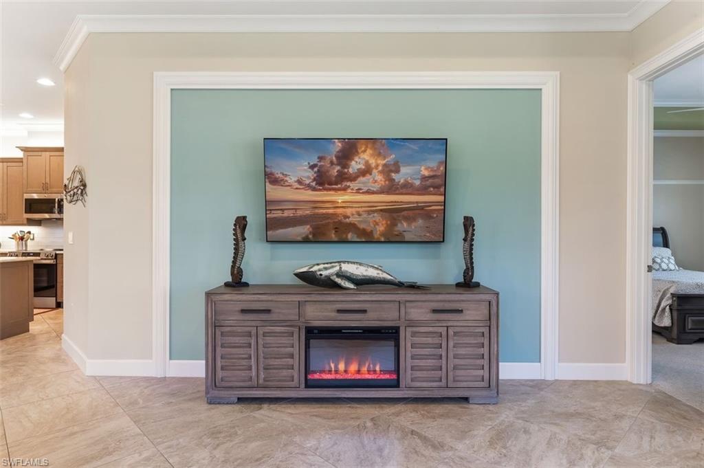 6931 Cay Court Naples, FL 34113 - Photo 7 of 24 Dining area featuring crown molding, a tray ceiling, and recessed lighting