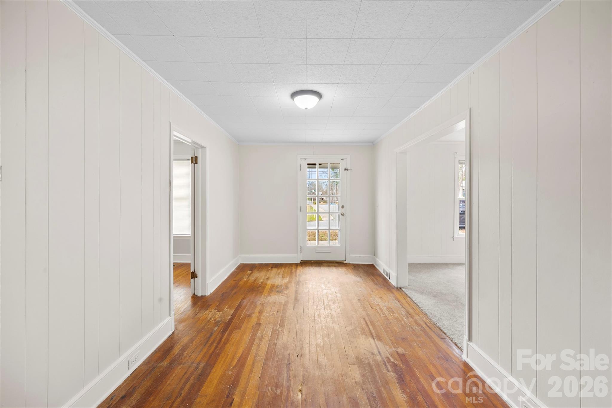 302 South Maple Street Dallas, NC 28034 - Photo 11 of 25 a view of a room with wooden floor and a window