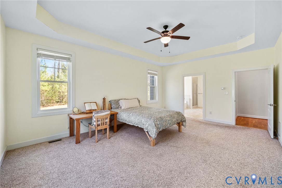 15430 River Road Chesterfield, VA 23838 - Photo 13 of 46 a spacious bedroom with a bed and a window