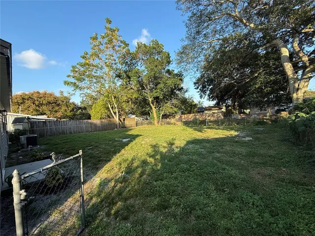 a view of a lake with a yard