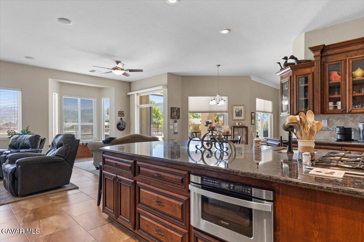 23840 Martingale Way Tehachapi, CA 93561 - Photo 17 of 63 a kitchen with sink and view of living room