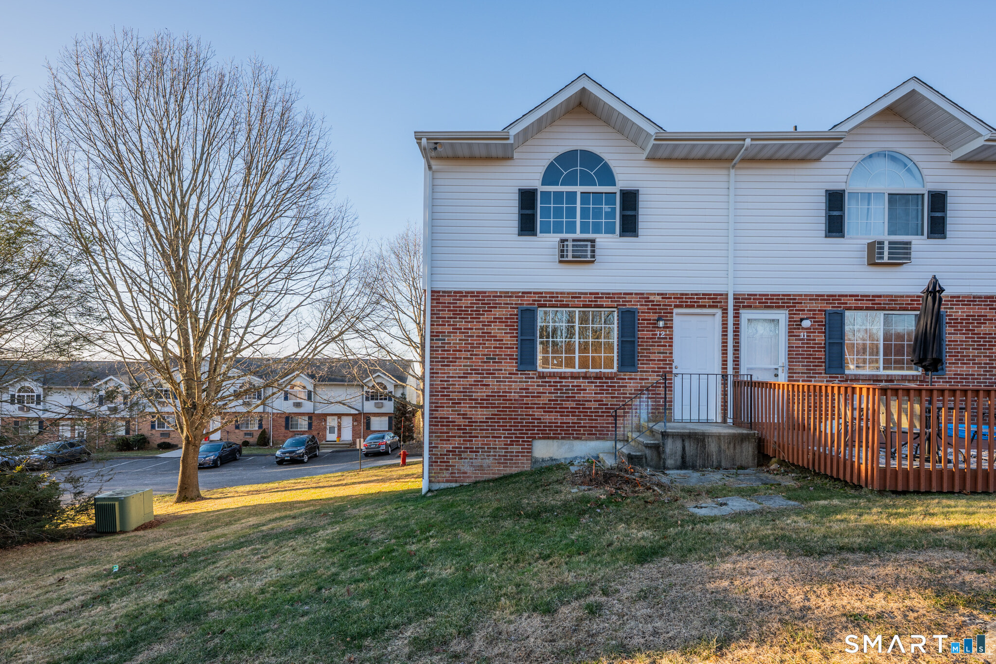 24 Blue Ridge Drive, Unit K12 Waterbury, CT 06704 - Photo 14 of 15 a front view of a house with a yard