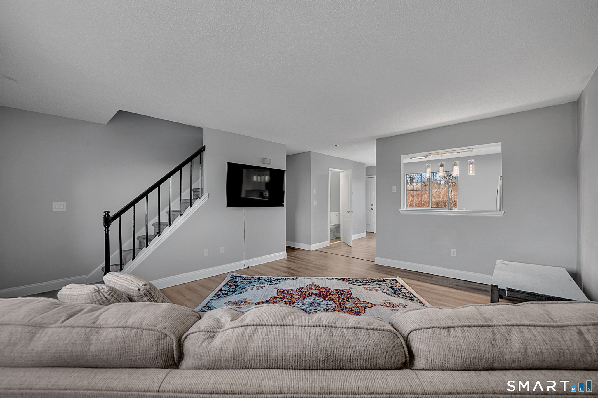 24 Blue Ridge Drive, Unit K12 Waterbury, CT 06704 - Photo 5 of 15 a living room with furniture and stairs
