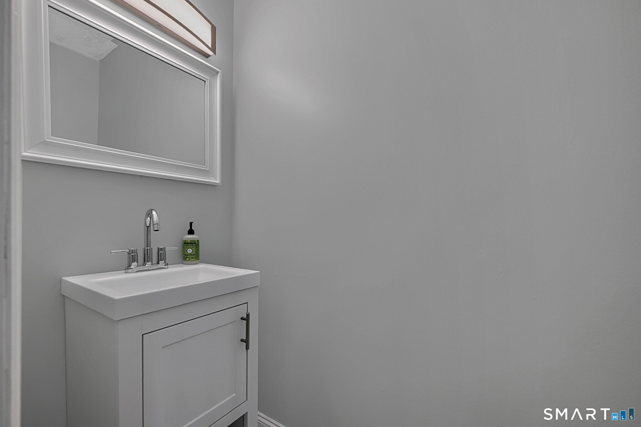 24 Blue Ridge Drive, Unit K12 Waterbury, CT 06704 - Photo 7 of 15 a bathroom with a sink a mirror and vanity