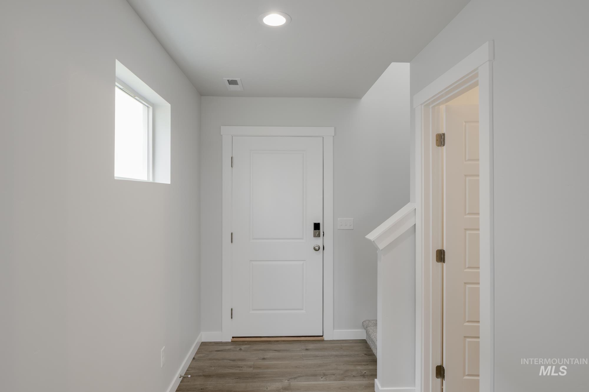 10873 Rutland Street Caldwell, ID 83605 - Photo 2 of 19 Doorway featuring wood finished floors and recessed lighting