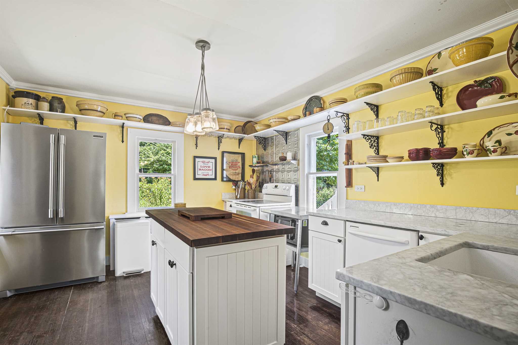 112 Malone Road Salt Point, NY 12578 - Photo 12 of 26 a kitchen that has a kitchen island wooden floors and stainless steel appliances