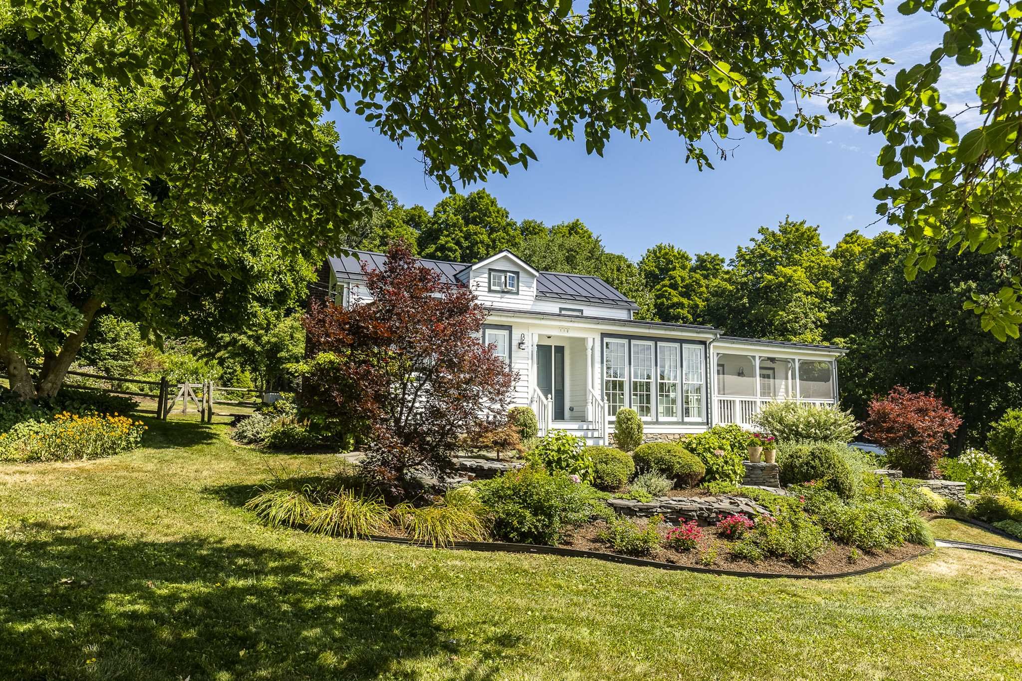 112 Malone Road Salt Point, NY 12578 - Photo 3 of 26 a front view of a house with a garden