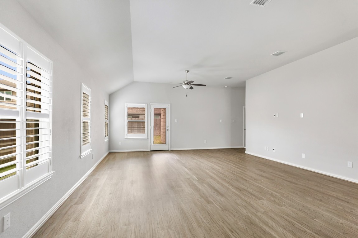 20811 Magical Merlin Way Tomball, TX 77375 - Photo 12 of 31 wooden floor in an empty room with a window