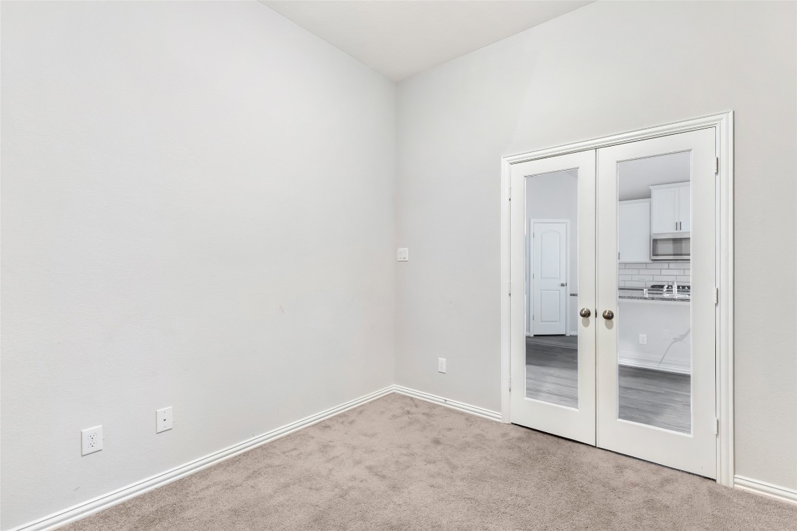 20811 Magical Merlin Way Tomball, TX 77375 - Photo 16 of 31 an empty room with cabinet and mirrors