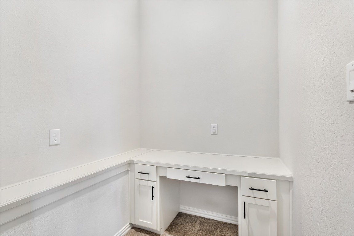 20811 Magical Merlin Way Tomball, TX 77375 - Photo 18 of 31 a view of a kitchen with white cabinets