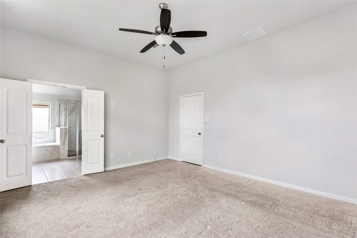 20811 Magical Merlin Way Tomball, TX 77375 - Photo 20 of 31 a view of a livingroom with a ceiling fan and window