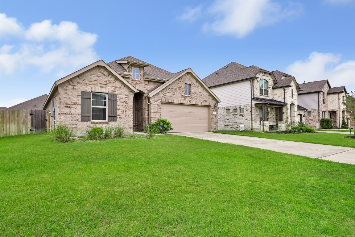 20811 Magical Merlin Way Tomball, TX 77375 - Photo 2 of 31 a front view of house with yard and green space