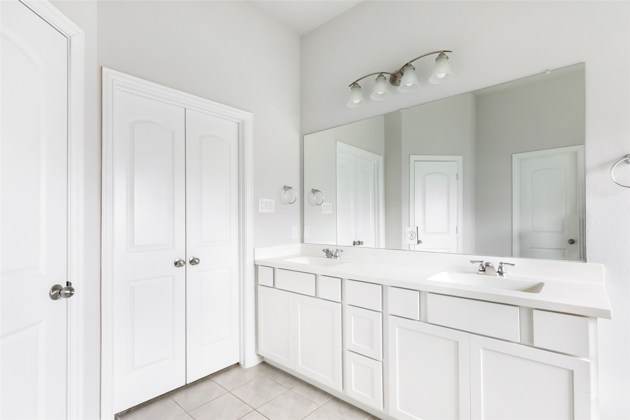 20811 Magical Merlin Way Tomball, TX 77375 - Photo 22 of 31 a bathroom with a sink and a mirror