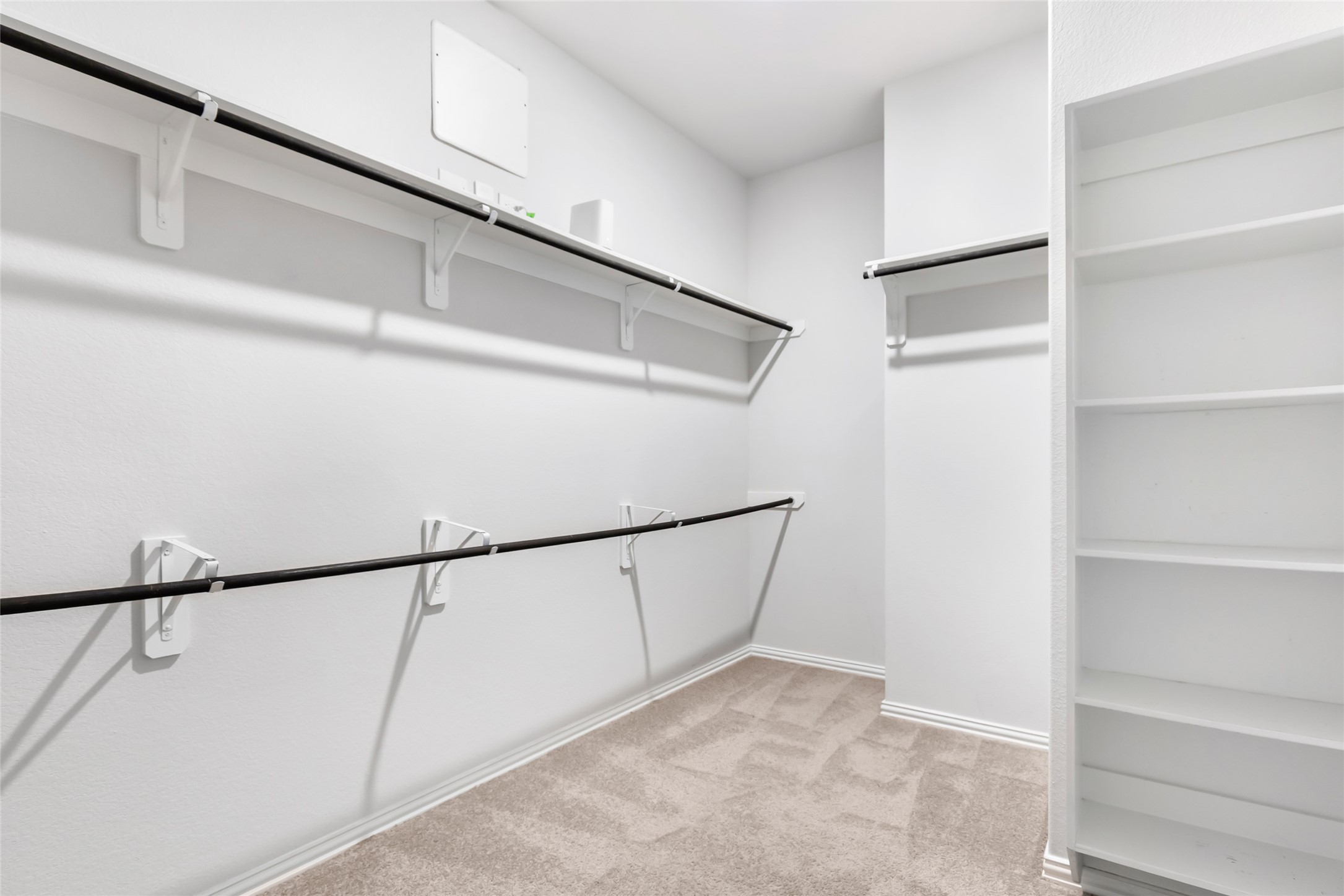 20811 Magical Merlin Way Tomball, TX 77375 - Photo 23 of 31 a view of walk in closet with empty racks