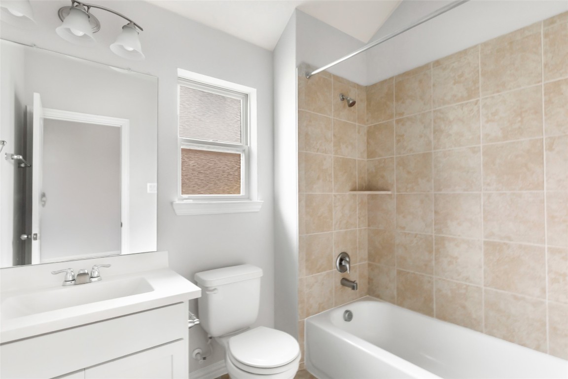 20811 Magical Merlin Way Tomball, TX 77375 - Photo 25 of 31 a bath room with a toilet a sink and a bath tub