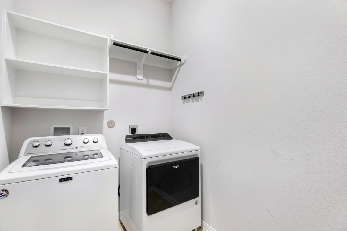 20811 Magical Merlin Way Tomball, TX 77375 - Photo 29 of 31 a utility room with dryer and washer