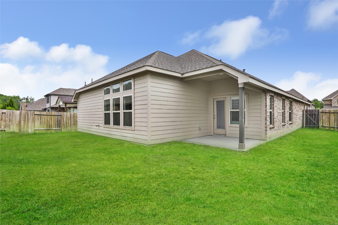 20811 Magical Merlin Way Tomball, TX 77375 - Photo 30 of 31 a front view of a house with a garden