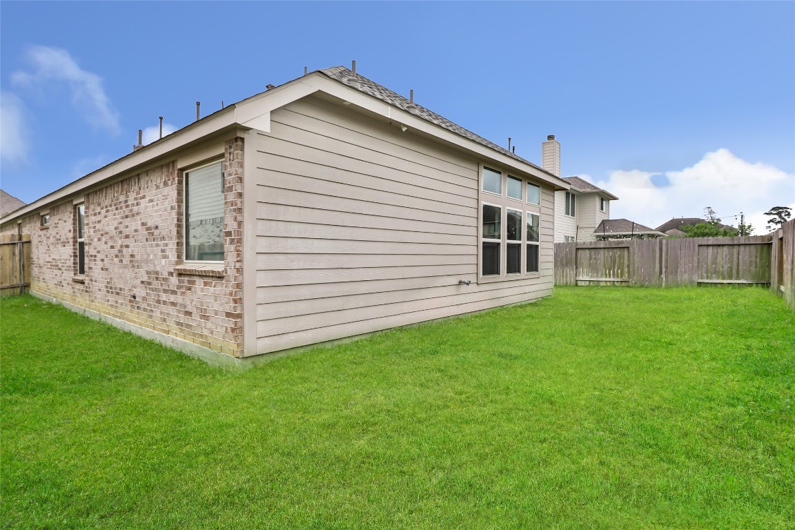20811 Magical Merlin Way Tomball, TX 77375 - Photo 31 of 31 a front view of a house with garden