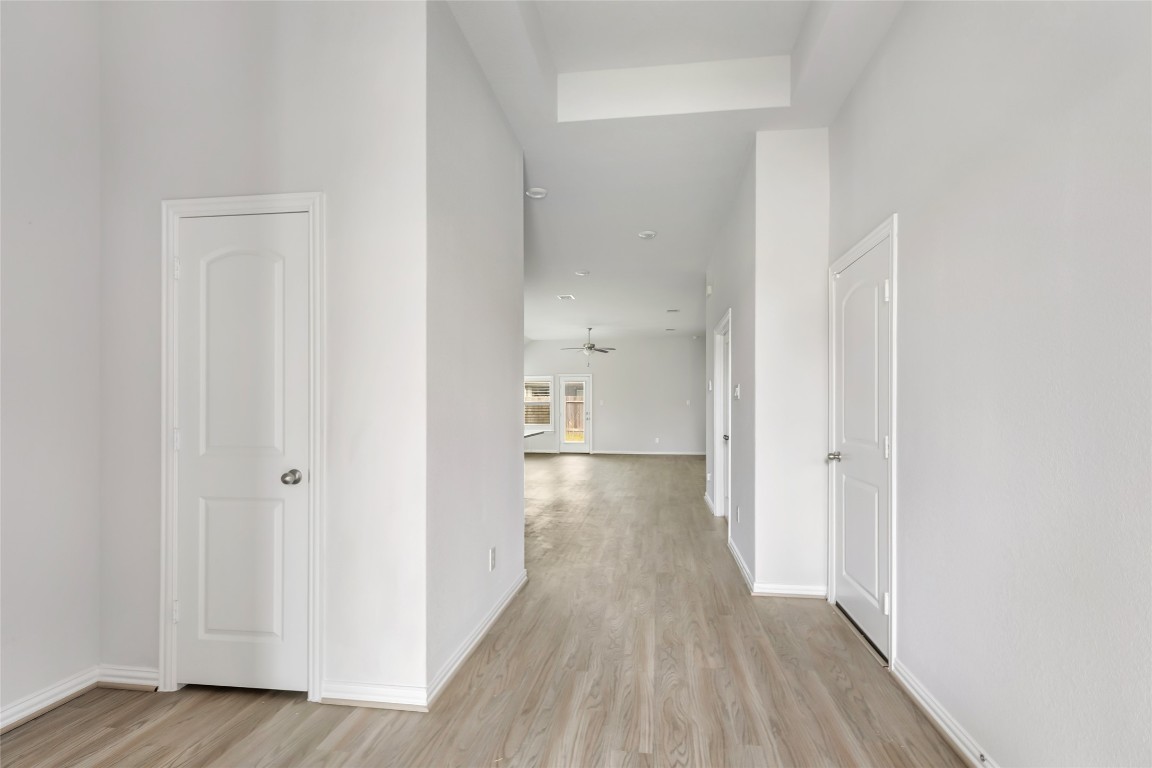 20811 Magical Merlin Way Tomball, TX 77375 - Photo 6 of 31 a view of a hallway with wooden floor