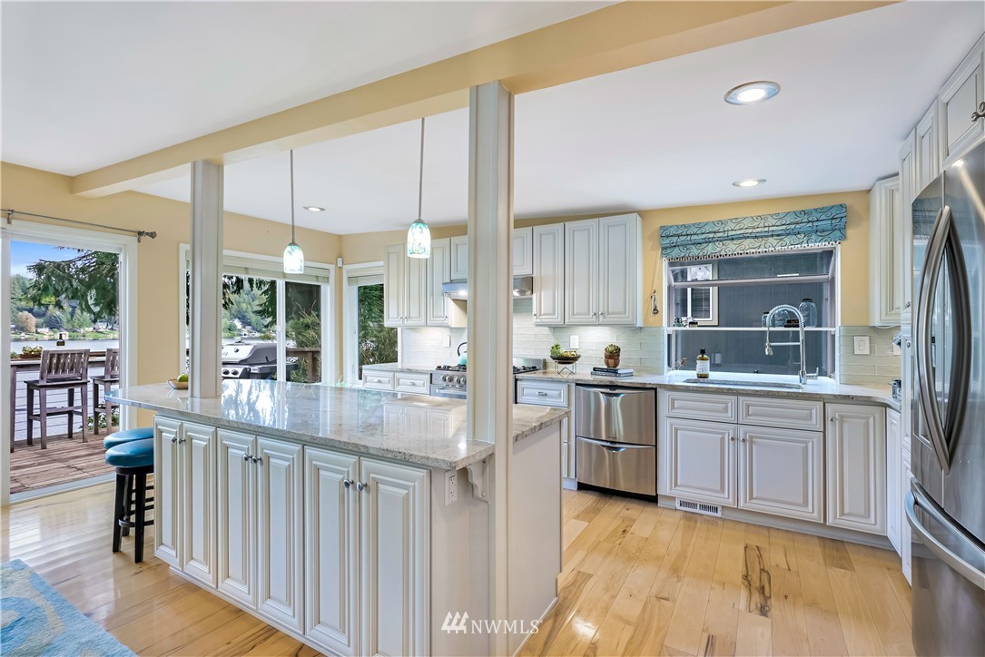 1817 Southwest Lake Roesiger Road Snohomish, WA 98290 - Photo 15 of 37 a kitchen with stainless steel appliances granite countertop a stove and cabinets