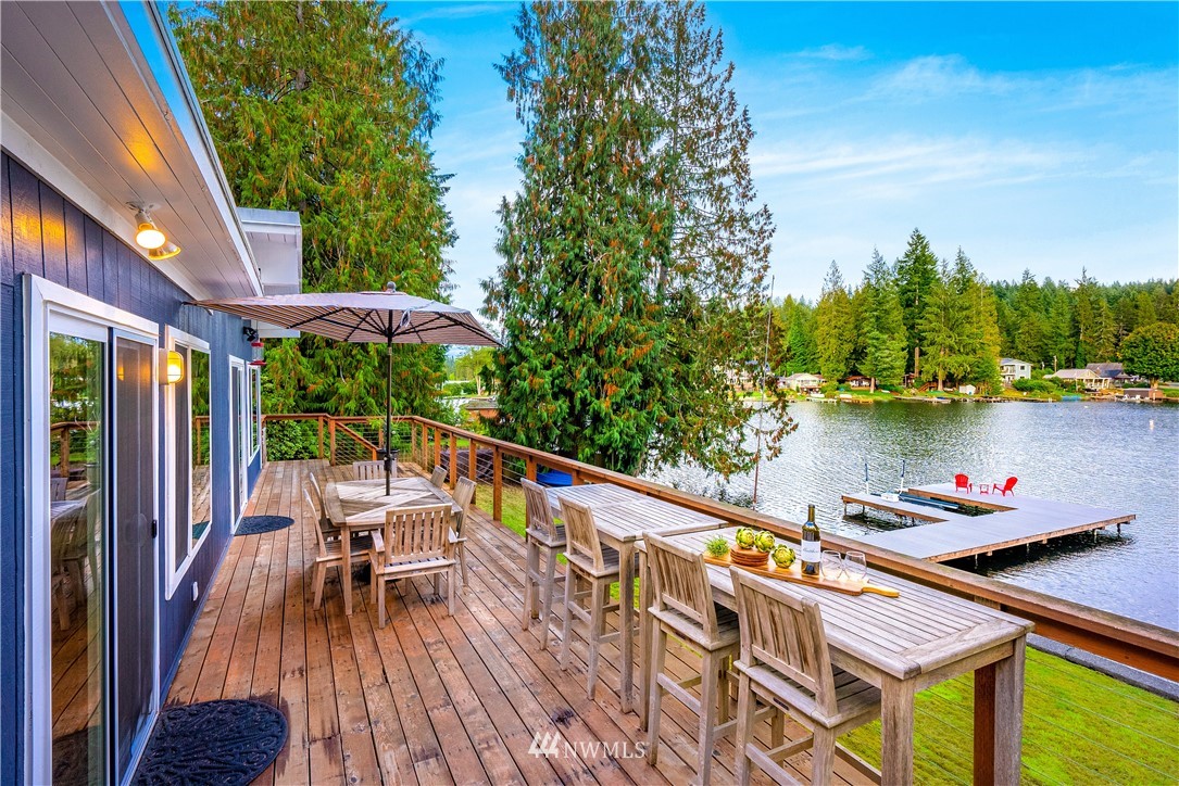 1817 Southwest Lake Roesiger Road Snohomish, WA 98290 - Photo 19 of 37 a balcony with furniture and a potted plant